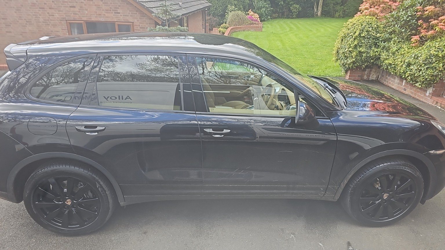Black Porsche with refurbished black alloy wheels